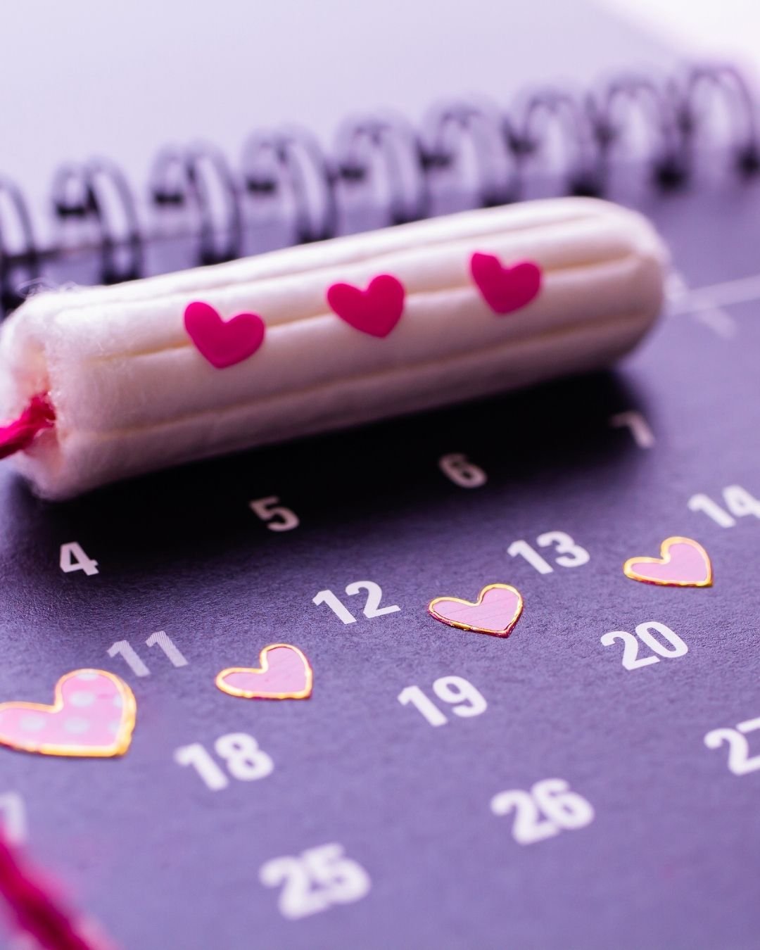 Tampon and calendar with heart icons